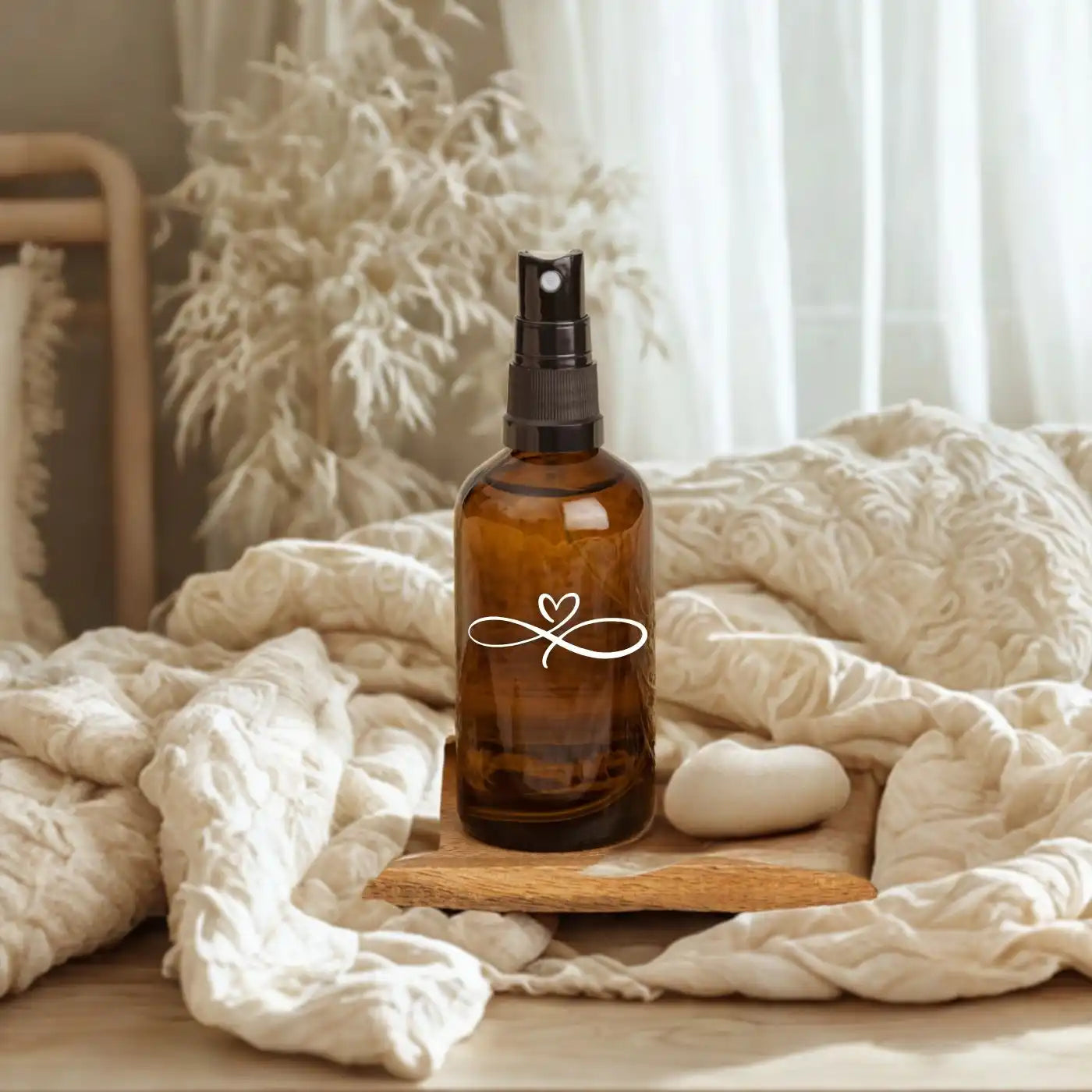 Amber glass spray bottle with a black mister top.