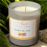 Candle with 'Heavenly Aroma' label on a natural background