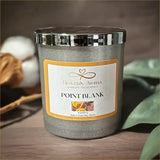 Candle with 'Heavenly Aroma' label on a wooden surface