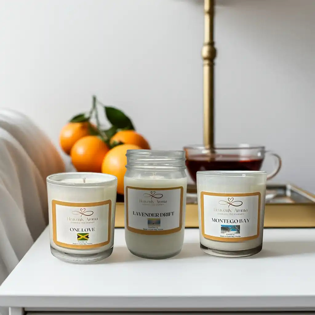 Three white scented candles in glass jars.