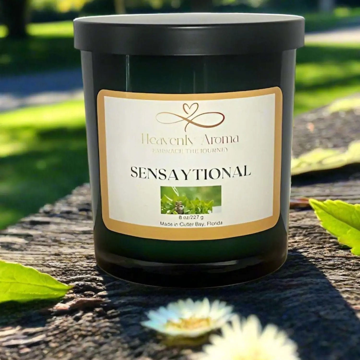 Dark green Sensational label candle jar from Hearts Abloom, a natural soy candle.