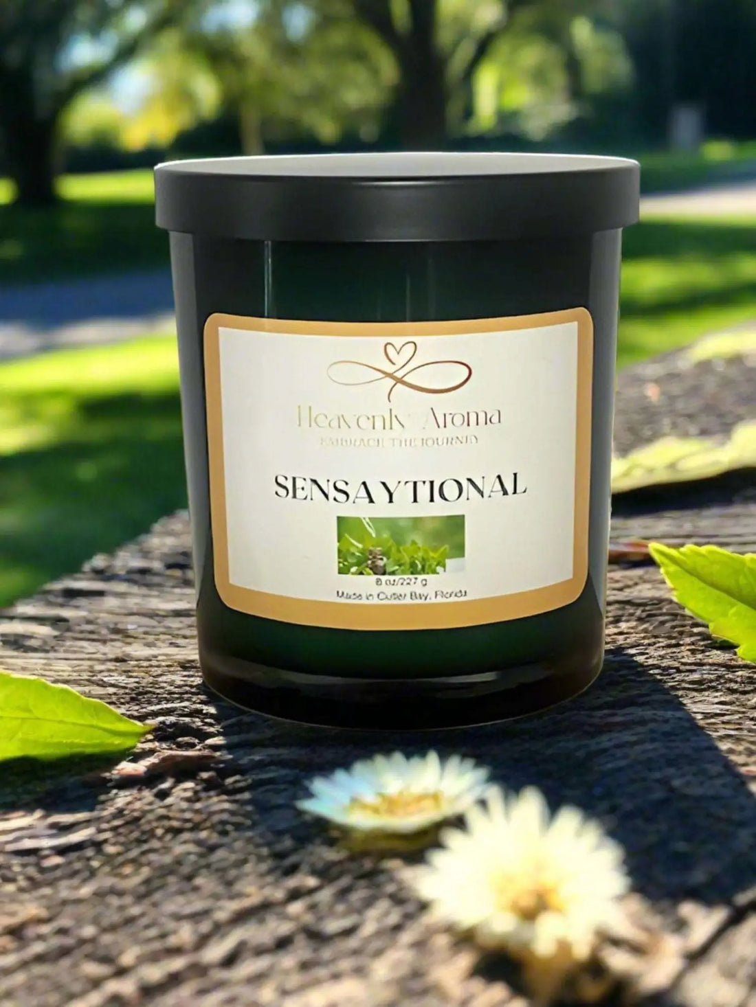 Dark green Sensational label candle jar from Hearts Abloom, a natural soy candle.