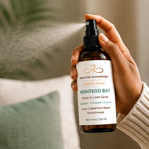 Hand using Montego Bay Room & Linen Spray to refresh a room with a botanical mist.