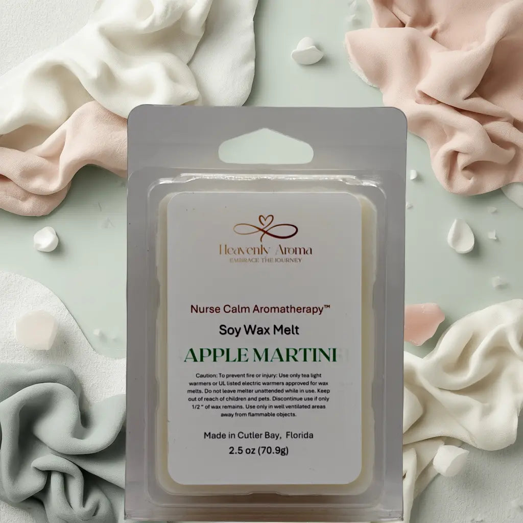 Soy wax melt package labeled 'Apple Martini' by Heavenly Aroma on a soft fabric background.