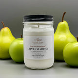Candle jar labeled 'Apple Martini' with pears and apples on a gray background