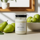 Jar of 'Apple Martini' candle with pears and a bowl on a table
