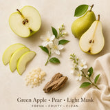 Flat lay of Apple Martini fragrance inspiration featuring fresh green apples, ripe pears, light musk elements, and natural botanicals representing the fragrance profile.