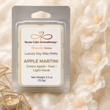 Apple Martini luxury soy wax melt by Nurse Calm Aromatherapy™ in a clear clamshell package with cream floral background and warm gold accents. Scent notes include green apple, pear, and light musk.
