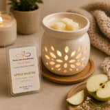 Apple Martini Luxury Soy Wax Melts melting in a ceramic wax warmer, filling the room with the fresh scent of green apple, pear, and soft musk.