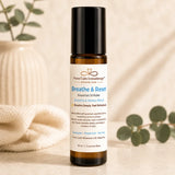 Breathe & Reset Essential Oil Roller by Nurse Calm Aromatherapy with eucalyptus, peppermint and tea tree in a luxury spa setting.