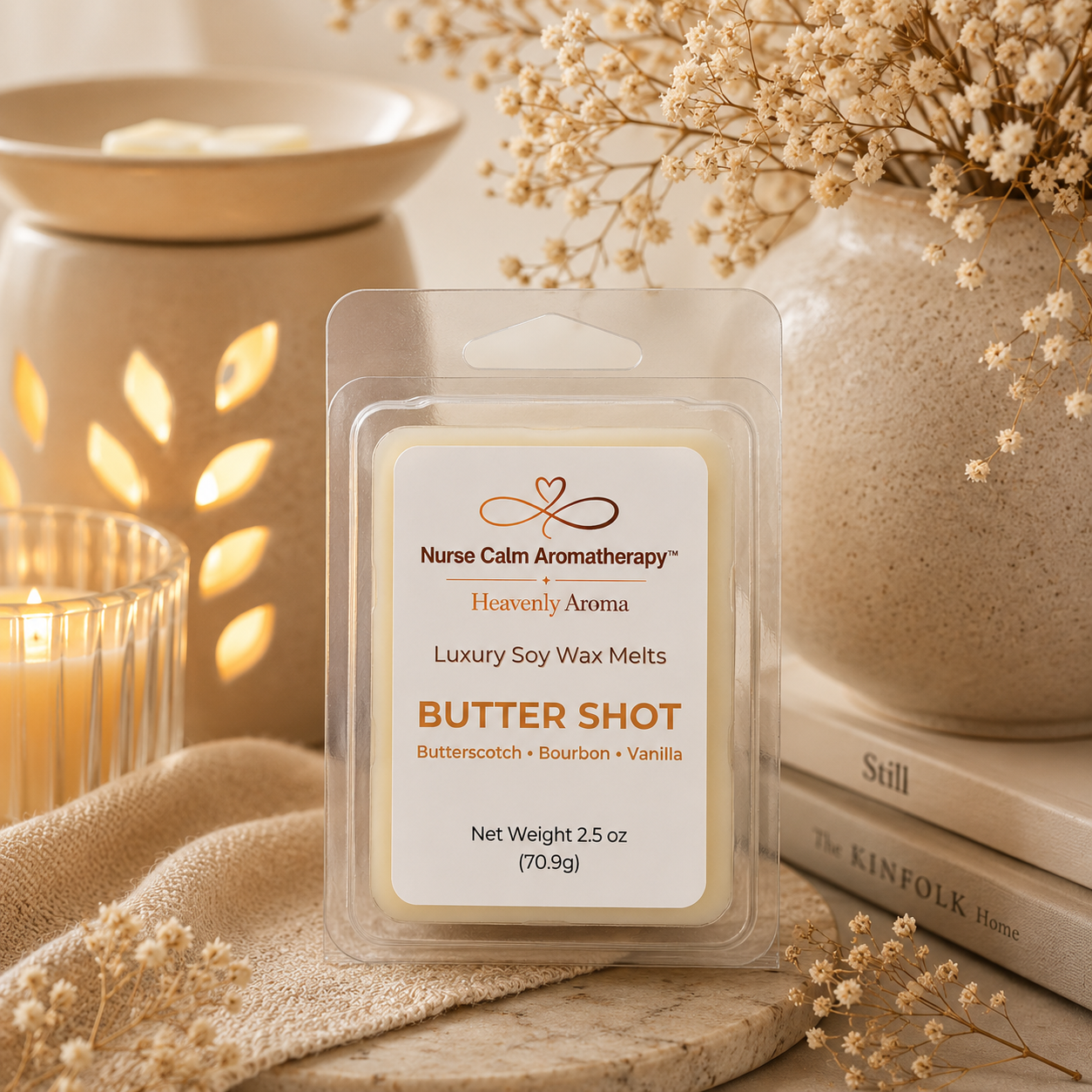 Nurse Calm Aromatherapy Butter Shot wax melt packaging with a candle and vase in the background