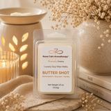 Nurse Calm Aromatherapy Butter Shot wax melt packaging with a candle and vase in the background