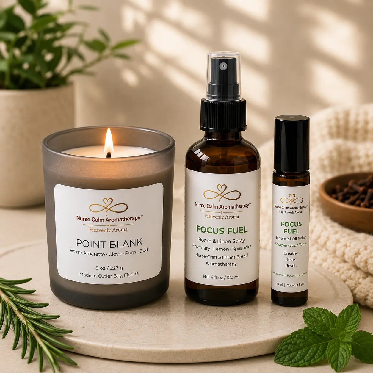 Close-up of the Focus & Energy Ritual bundle featuring Point Blank candle, Focus Fuel Room & Linen Spray, and Focus Fuel Essential Oil Roller.
