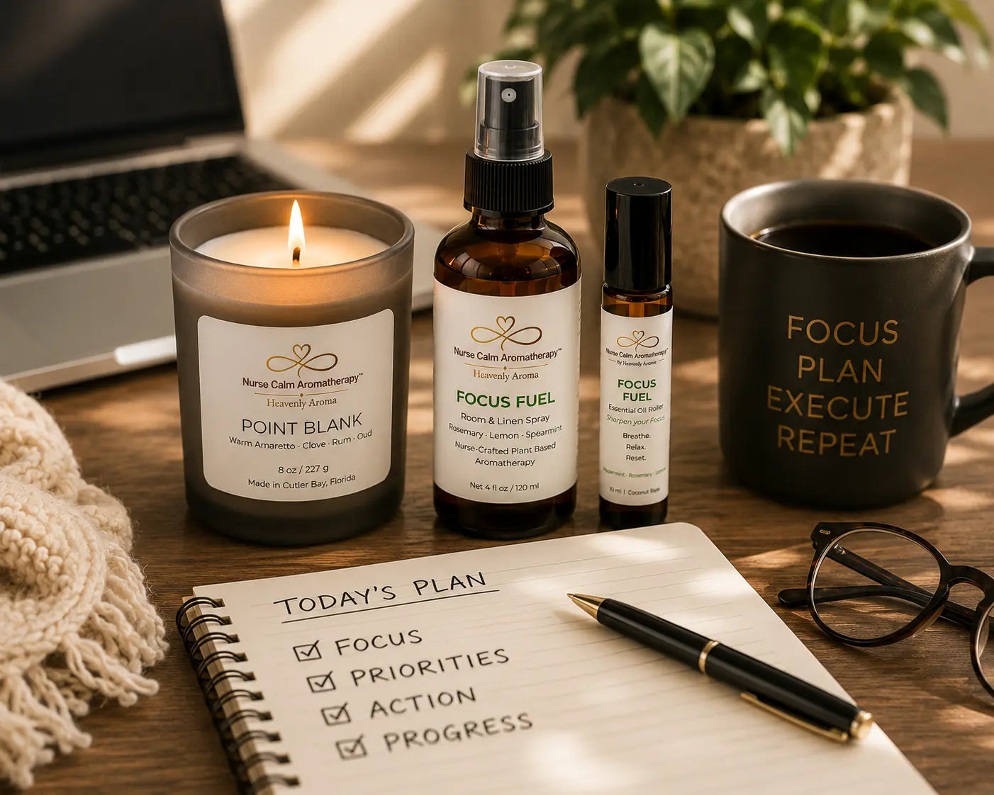 Focus & Energy Ritual wellness bundle styled in a productive workspace with Point Blank candle, Focus Fuel aromatherapy products, coffee, and a planning journal.