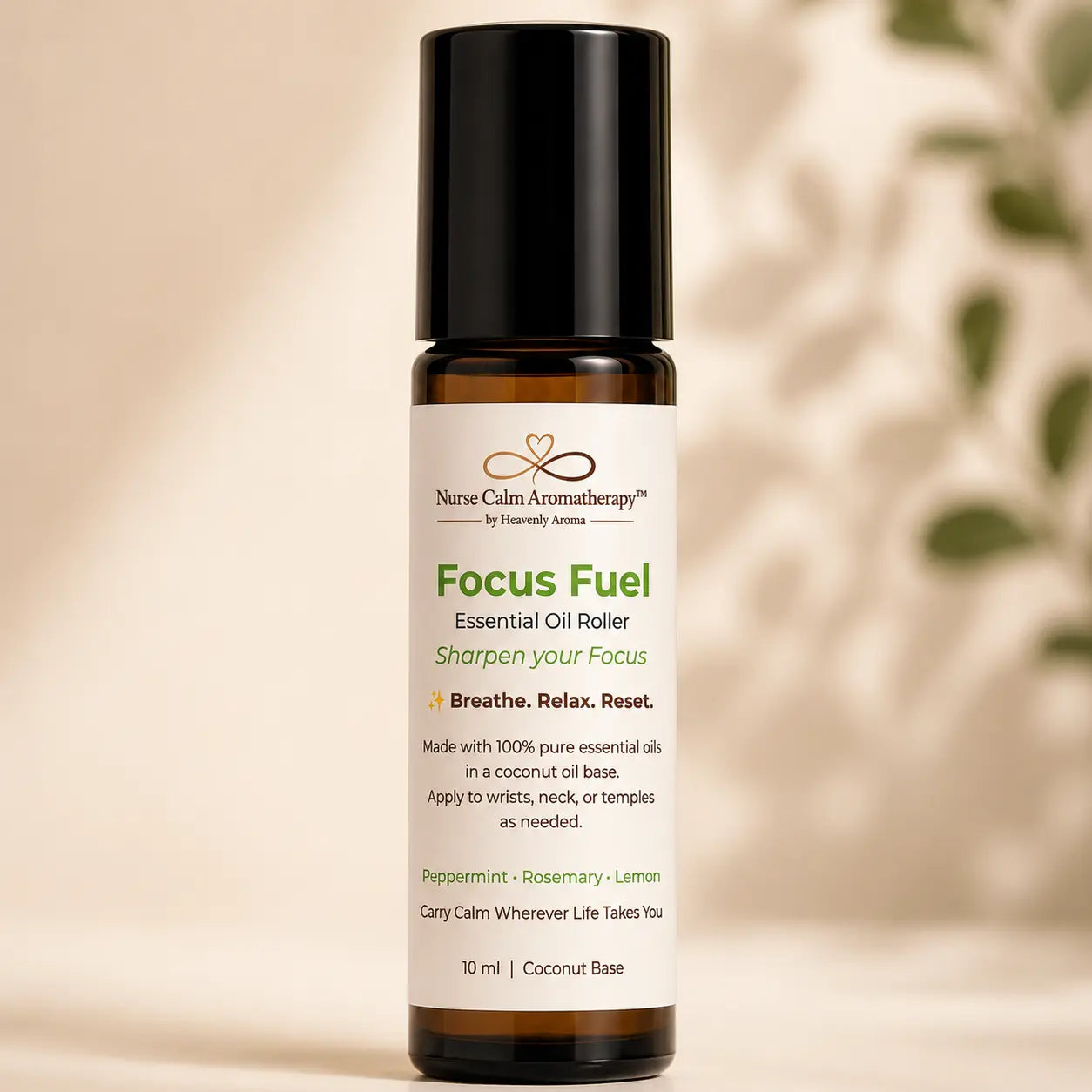 Close-up of Focus Fuel Essential Oil Roller featuring peppermint, rosemary and lemon in a 10 ml amber glass bottle.