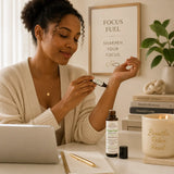 Focus Fuel Essential Oil Roller displayed beside a journal and morning coffee for a productive wellness routine.