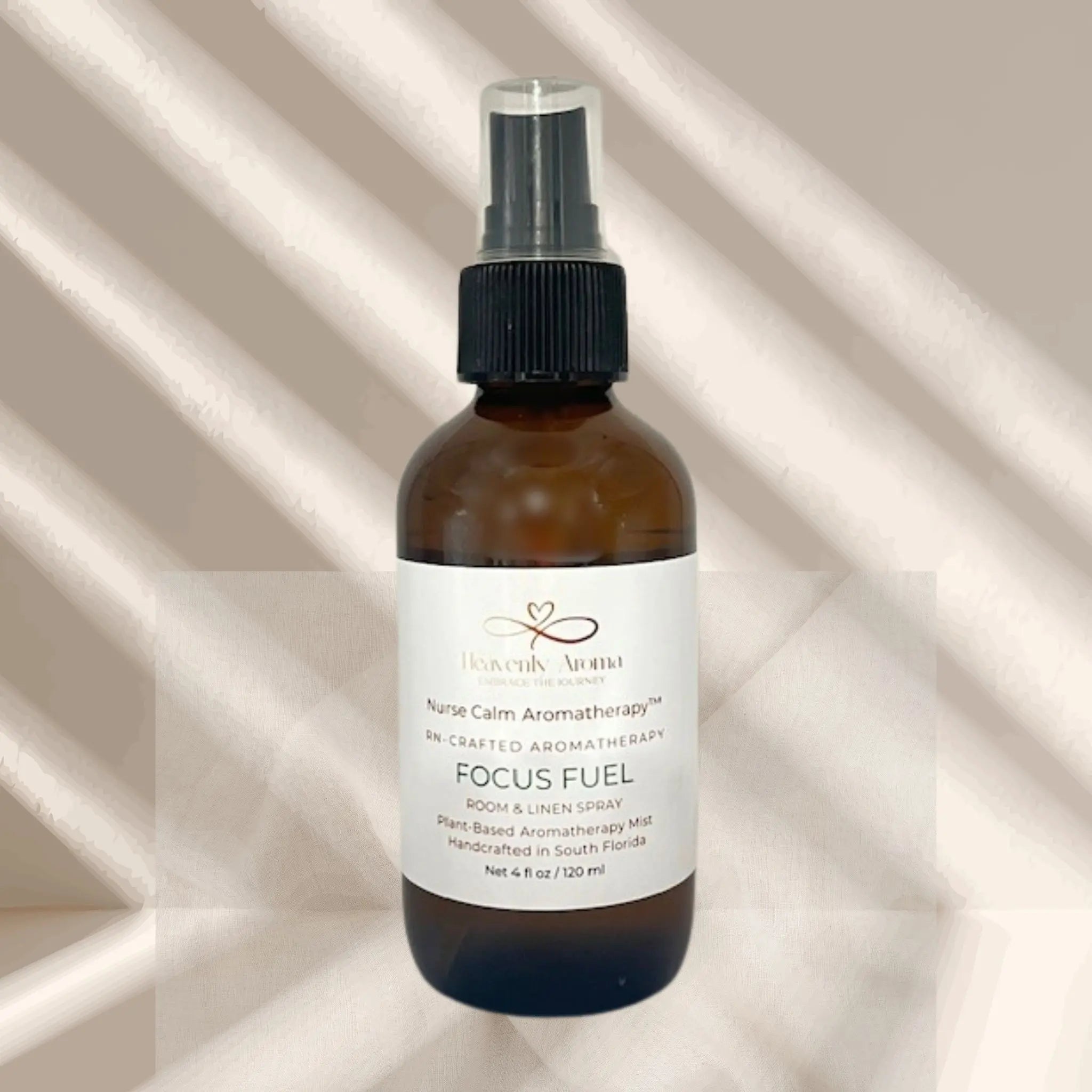 Brown spray bottle labeled 'Focus Fuel' on a beige background