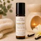 Close-up of Golden Hour Essential Oil Roller featuring sweet orange, bergamot and vanilla in a 10 ml amber glass bottle.
