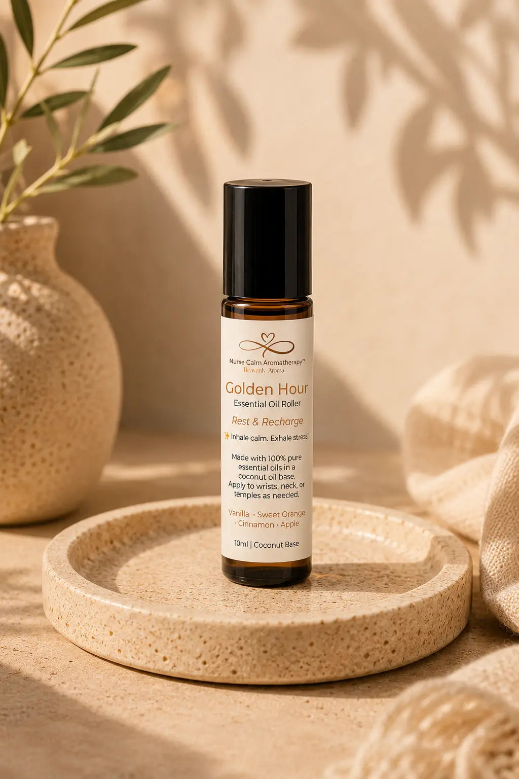 Essential oil roller bottle labeled 'Golden Hour' on a cork tray with a natural background