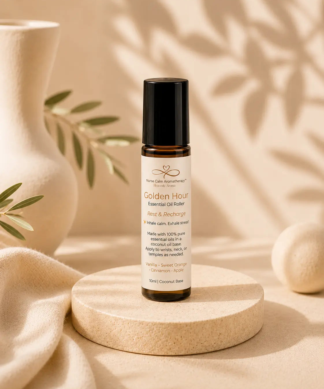 Roll-on bottle of 'Golden Hour' essential oil roller on a wooden platform with a neutral background