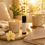 Golden Hour Essential Oil Roller displayed with cozy wellness essentials in warm golden light to encourage relaxation.