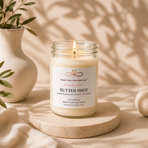 Butter Shot candle from Nurse Calm Aromatherapy on a wooden stand with a neutral background