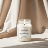 Candle in a glass jar labeled 'Lavender Drift' on a neutral background