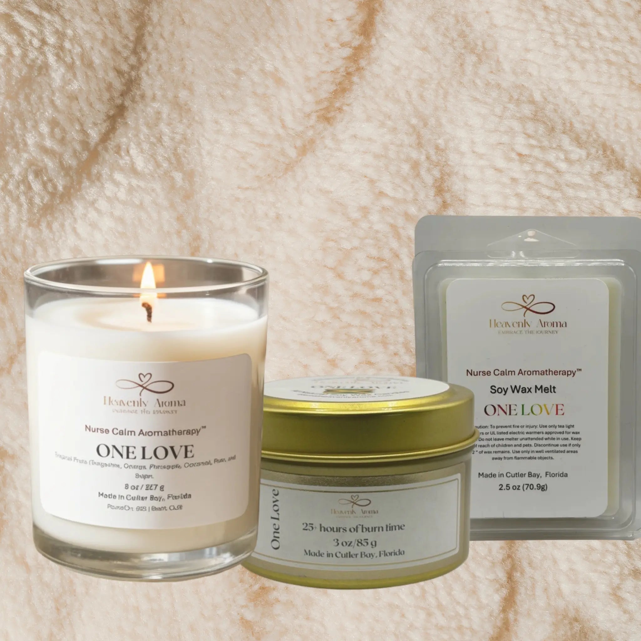 Candle, jar, and wax melt packaging with 'One Love' branding on a textured beige background.