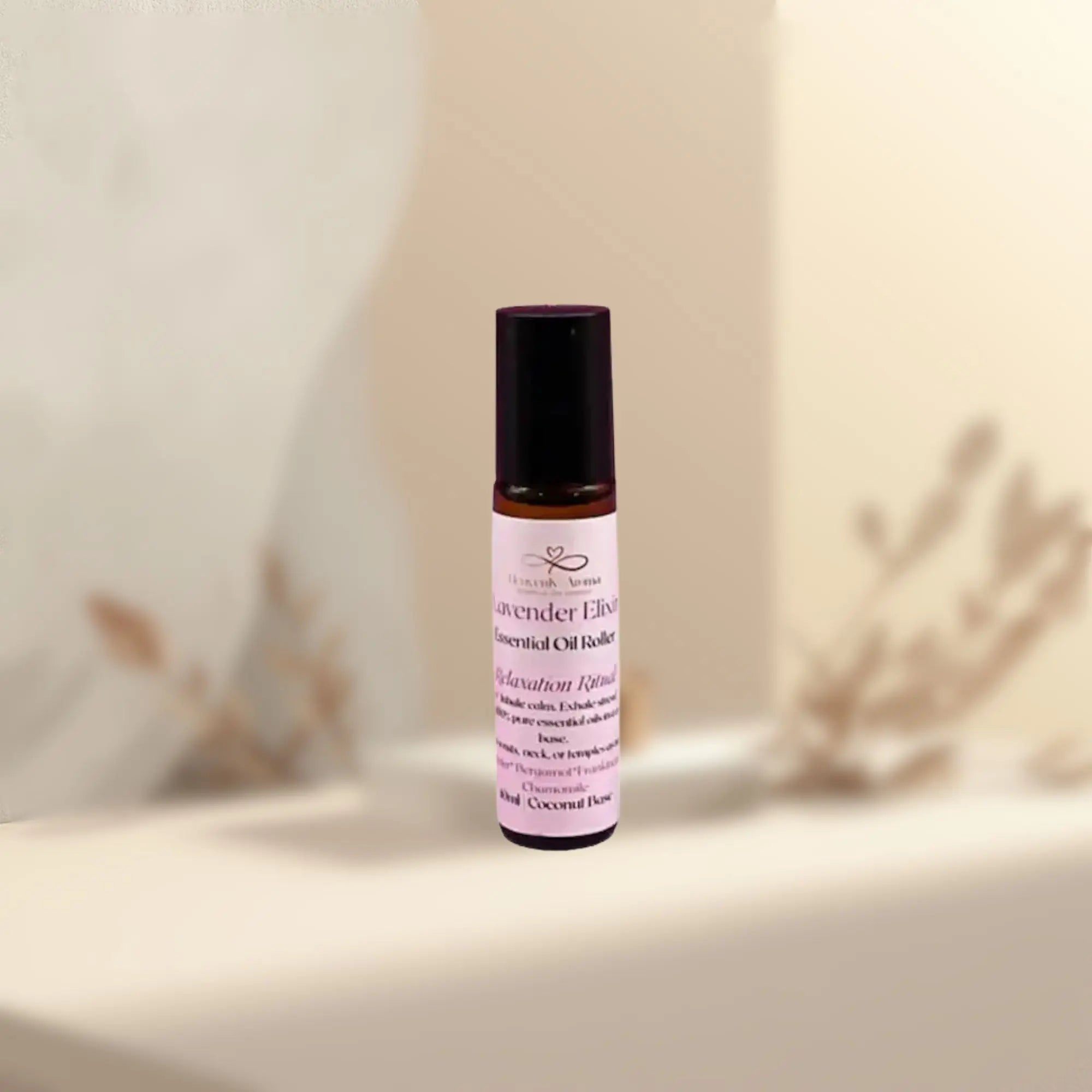 Roll-on bottle of Lavender Elixir essential oil balm on a neutral background