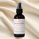 Nurse Calm Aromatherapy Montego Bay room & linen spray bottle on a beige fabric background