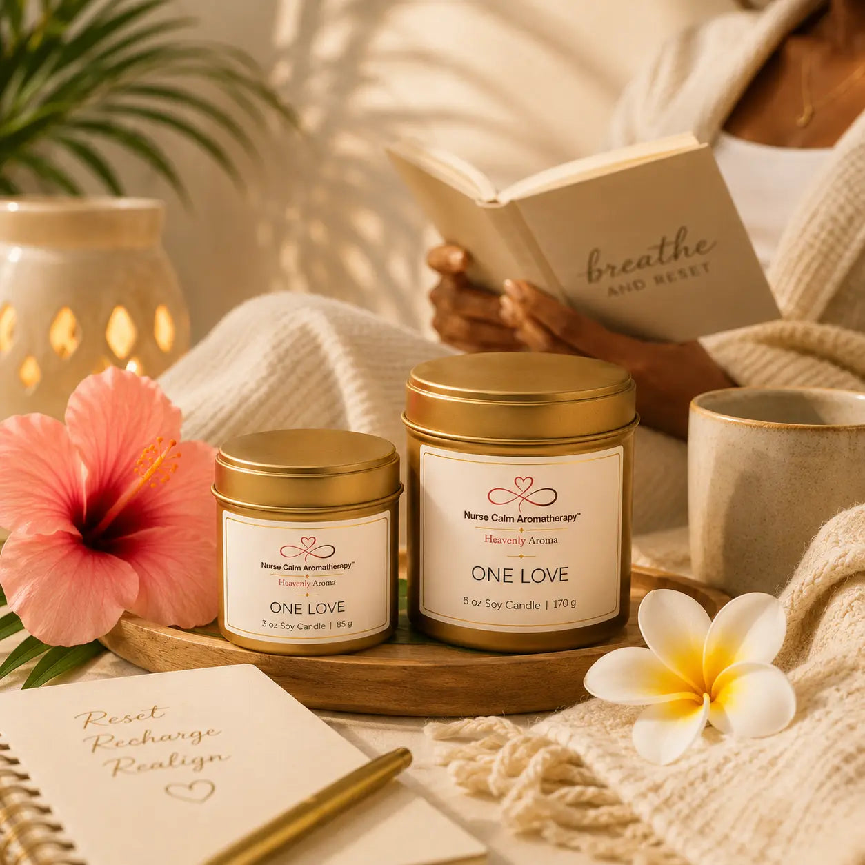 One Love Travel & Glow candle tins displayed in a cozy wellness setting encouraging relaxation, mindfulness, and portable self-care rituals.