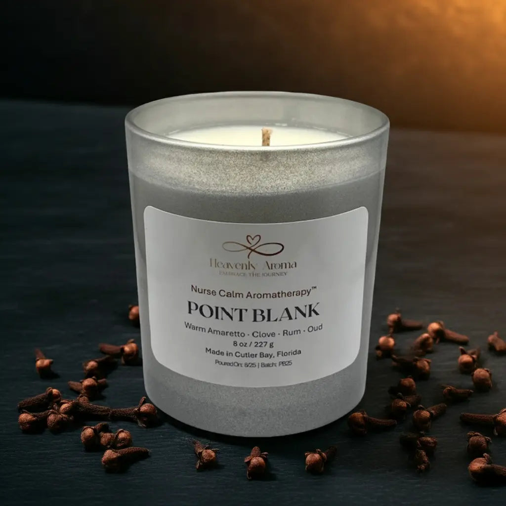 Aromatherapy candle with clove buds on a dark surface