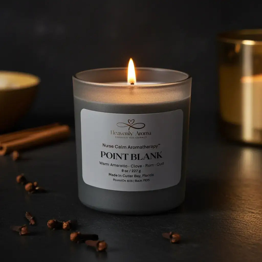 Candle with a label on a dark surface with cinnamon sticks and cloves.