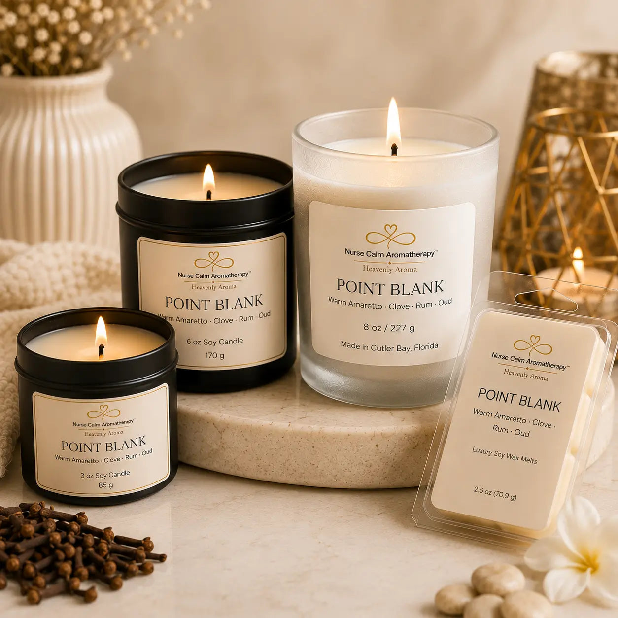 Close-up of the Point Blank Full Force Bundle showcasing the 8 oz candle, 6 oz travel candle, 3 oz travel candle, and wax melt with premium cream labels and handcrafted details.