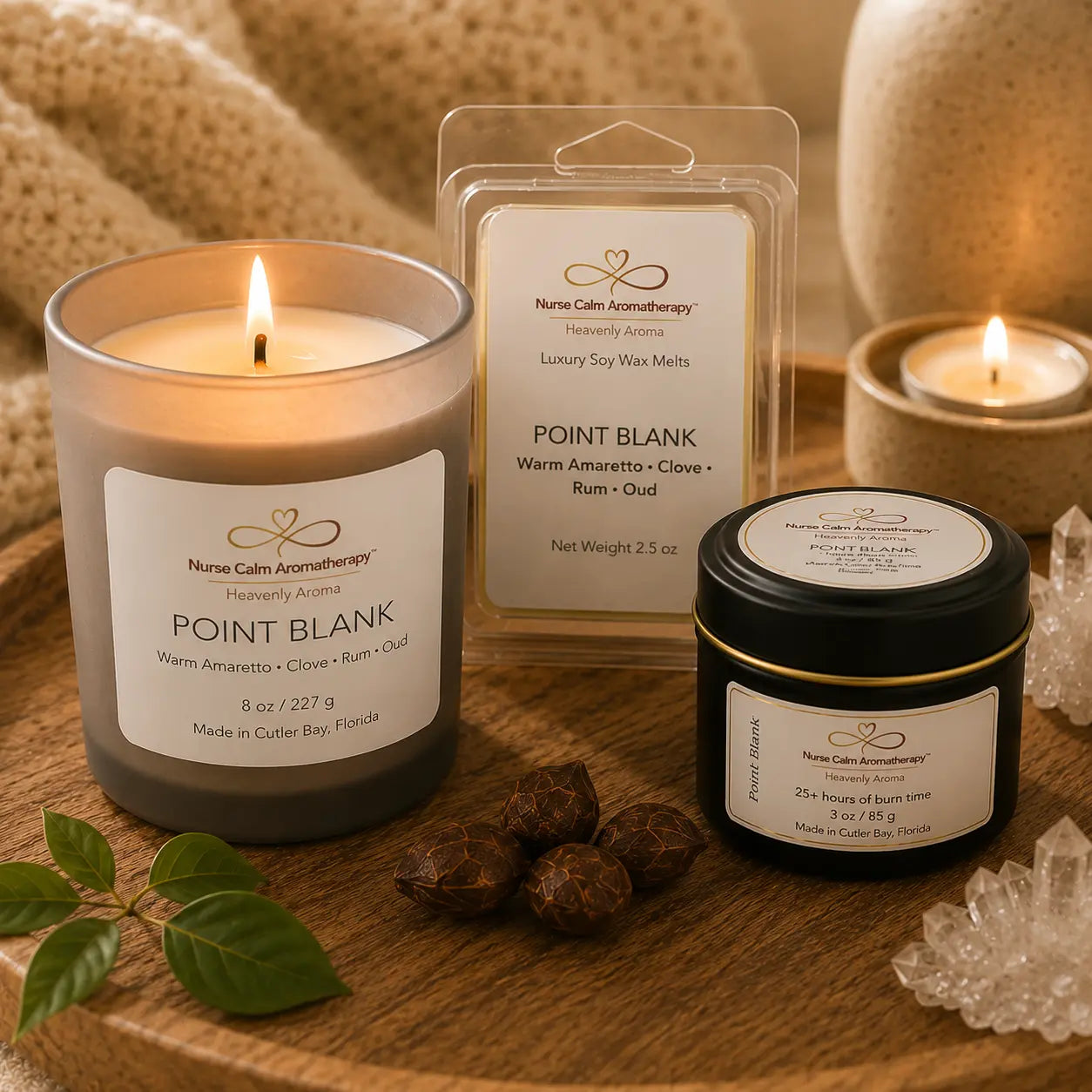 Close-up of the Point Blank Mini Power Set with 8 oz candle, 3 oz travel candle, and wax melt showcasing premium labels and luxury craftsmanship.
