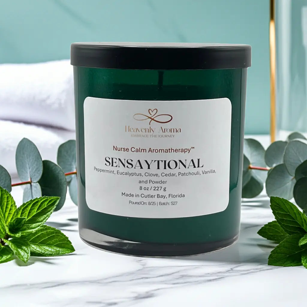 Candle jar labeled 'Sensaytional' by Heavenly Aroma with green leaves in the background