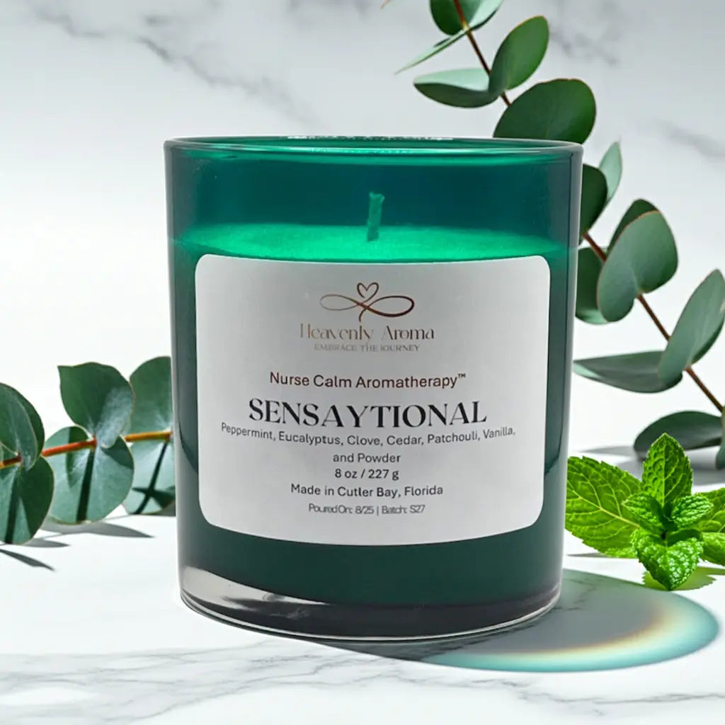 Green candle with a label on a white background with green leaves