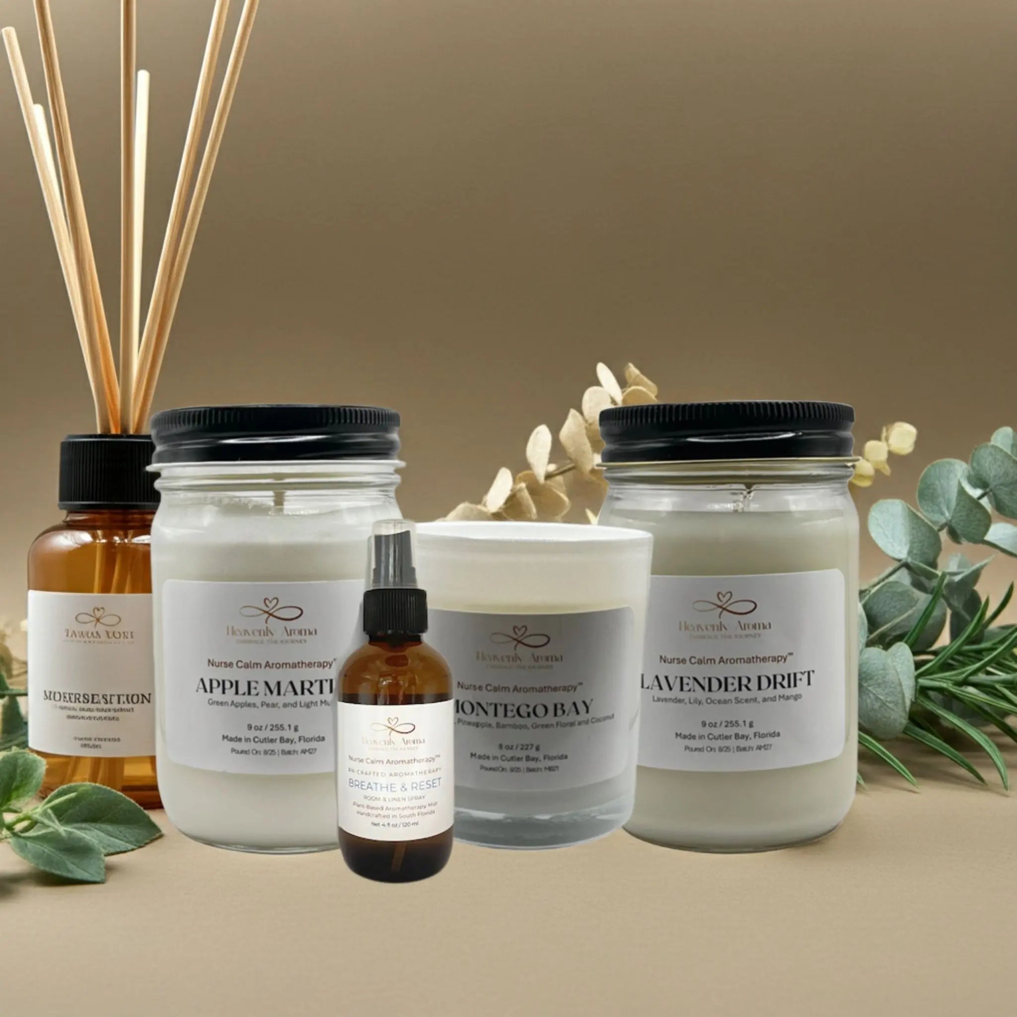 Collection of candles and diffusers with labels on a beige background