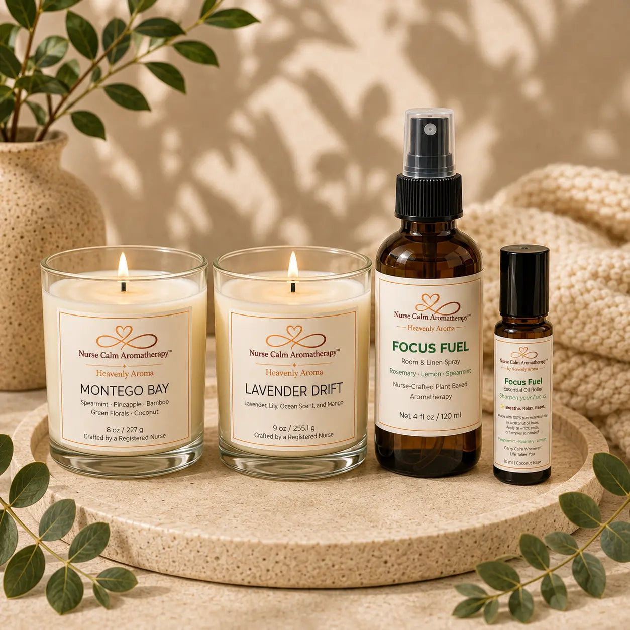 Close-up of the Signature Moments candle pair showcasing Montego Bay and Lavender Drift handcrafted soy candles with Focus Fuel aromatherapy products.