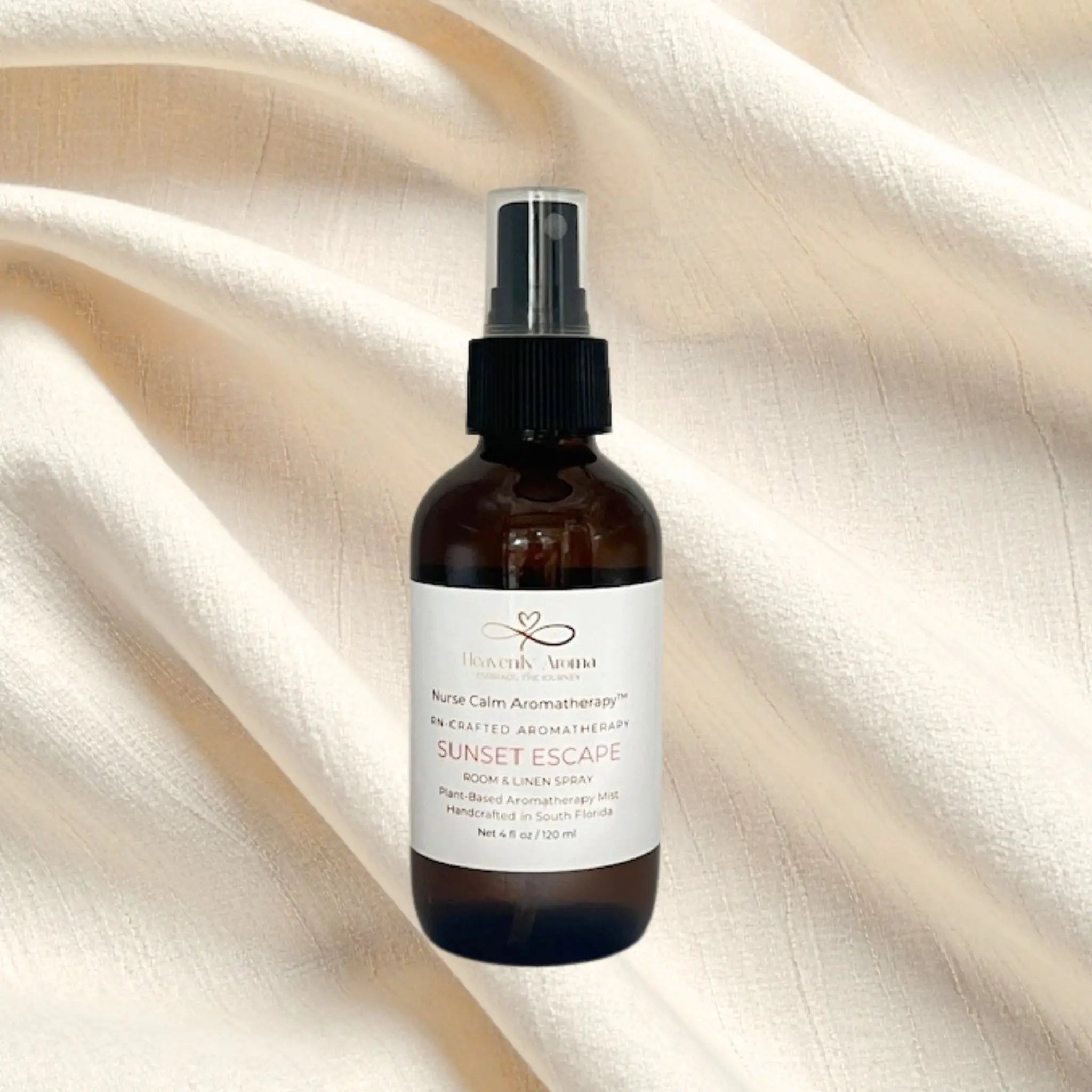 Brown spray bottle with a label on a beige fabric background