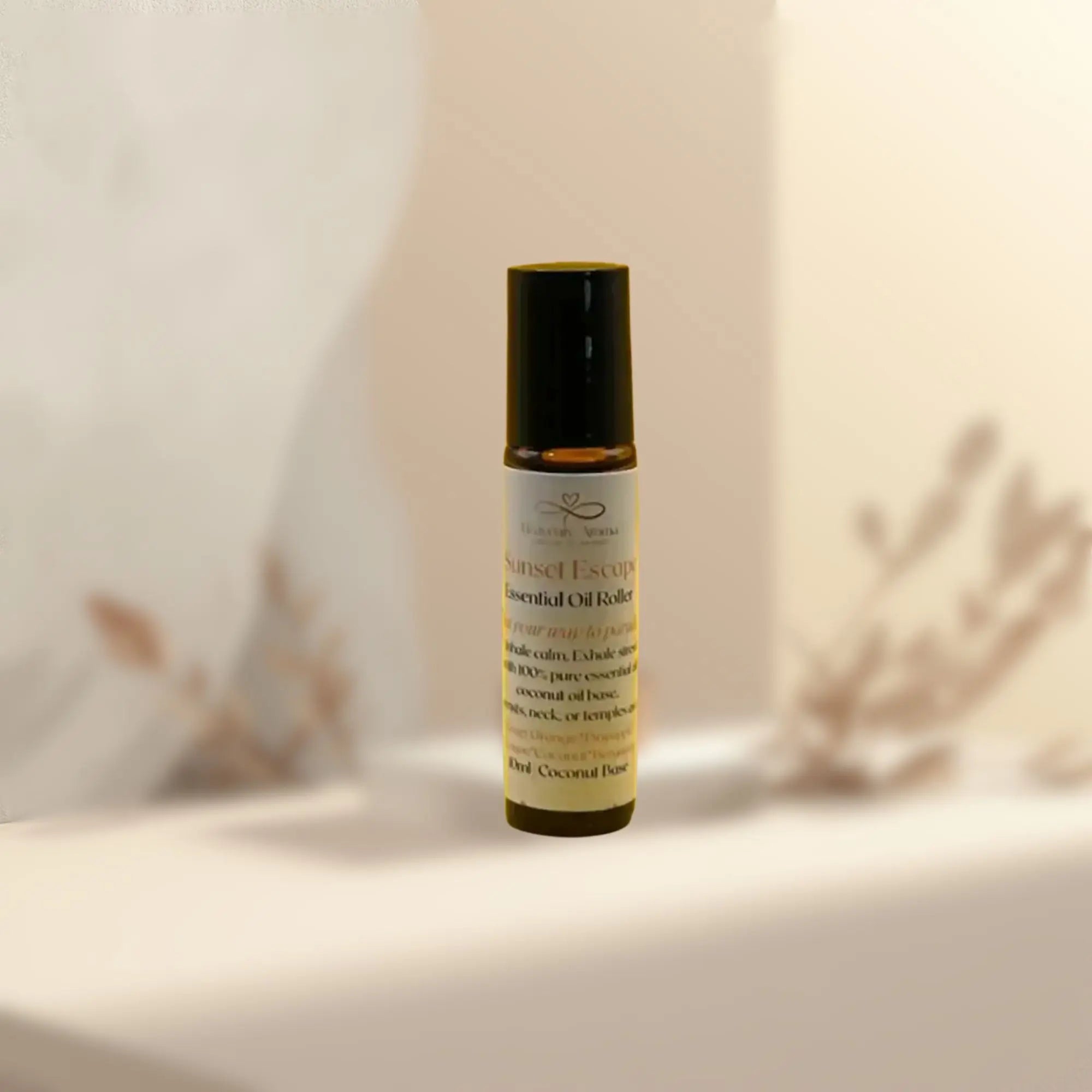 Roll-on bottle of essential oil on a neutral background