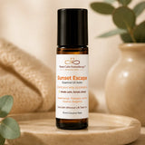Close-up of Sunset Escape Essential Oil Roller featuring sweet orange, pineapple, lemon, coconut and bergamot in a 10 ml amber glass bottle.