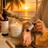 Tropical Escape self-care ritual featuring One Love candle, Sunset Escape Room & Linen Spray, and Sunset Escape Essential Oil Roller for a relaxing island-inspired aromatherapy experience.