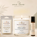 Candle, wax melts, and essential oil roller bottle with 'One Love' branding on a neutral background.