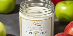 A glass jar candle with an ’Apple Martini’ scent.