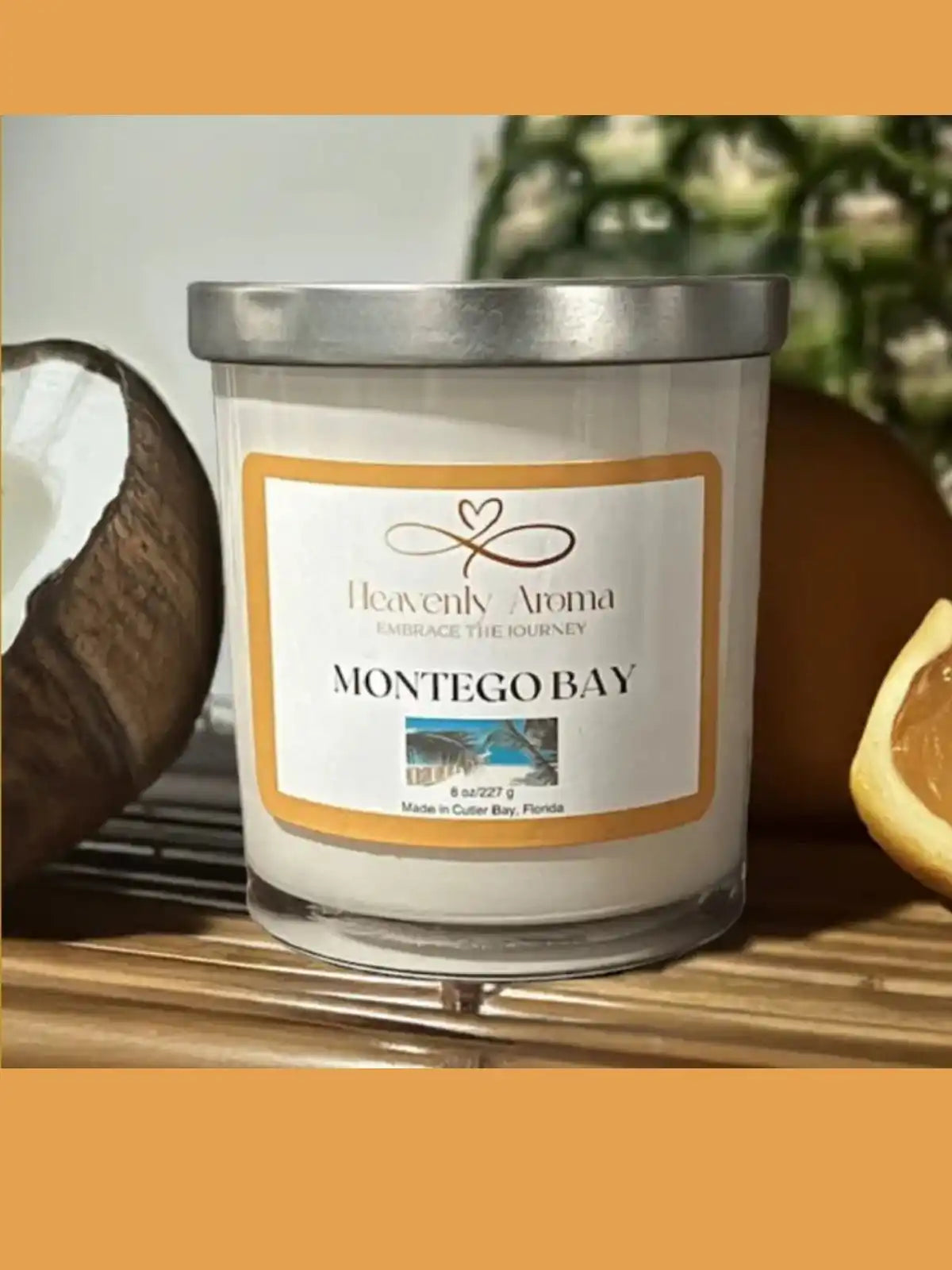 A white candle in a clear glass jar with a silver lid.